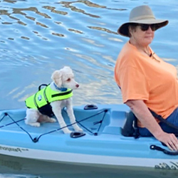 Schnoodle in a kayak in California Schnoodle Puppies